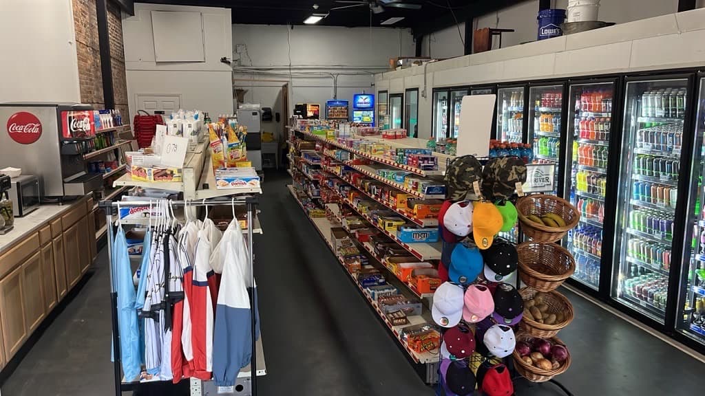Snack shelves and the coffee station near the front of the store.